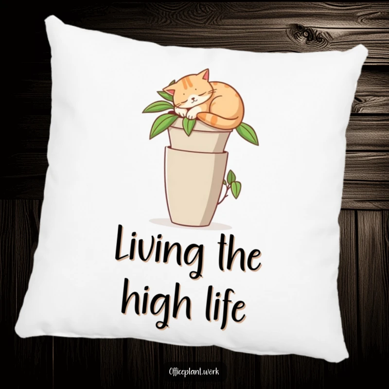 Funny pillow accentuating a contented cat napping on a tall office plant pot, offering humorous comfort and decor.