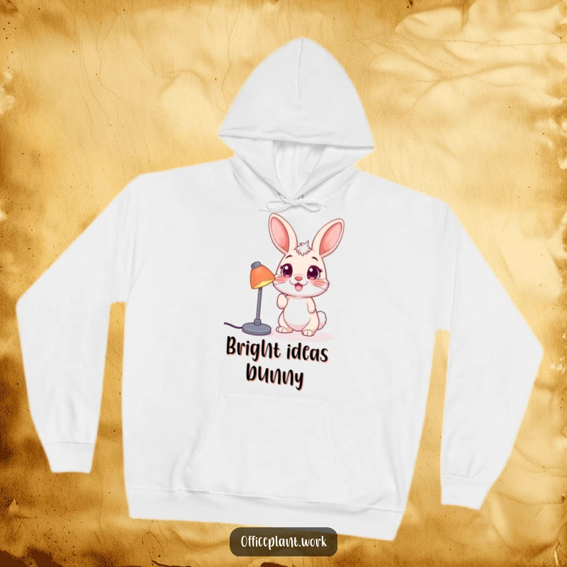 Funny bunny hoodie, a happy creature nudging a desk lamp, offering warmth and humor for cozy moments.
